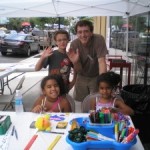 Larry Brown and youthful artists at sidewalk workshop